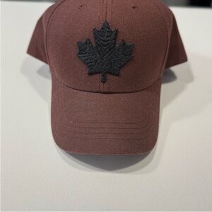 Roots Stylish Burgundy Cap with Black Leaf Emblem